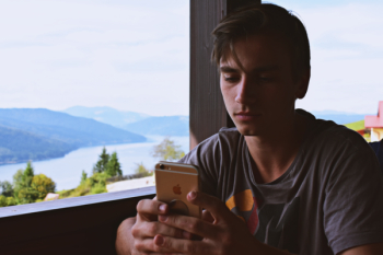 Man Holding Gold Iphone 6