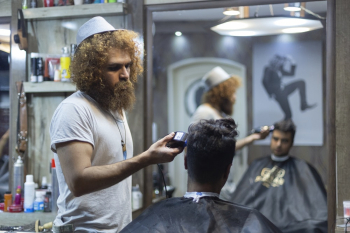 Man Holding Hair Clipper