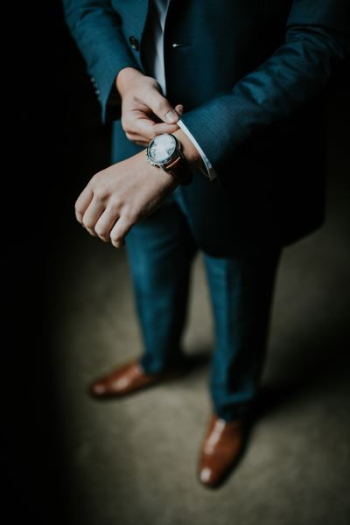 man holding his black suit man holding his black suit