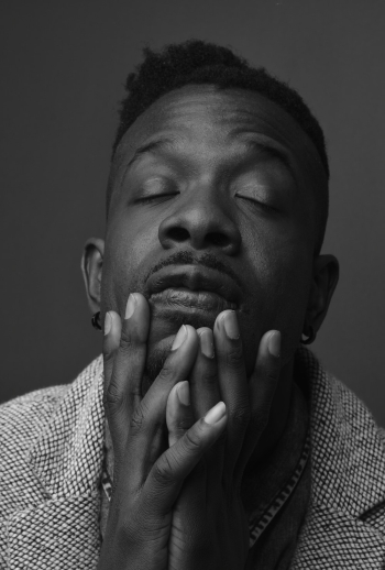 Man Holding His Face