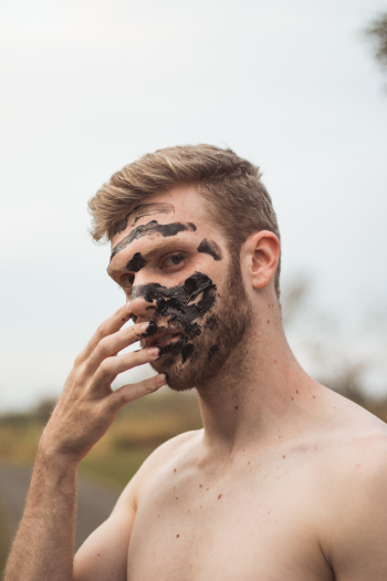 Man Holding His Face