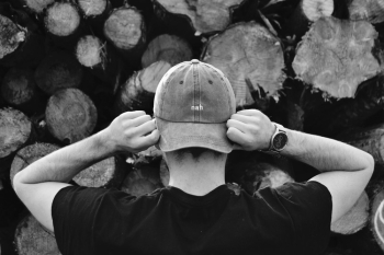 Man Holding His Hat Man Holding His Hat