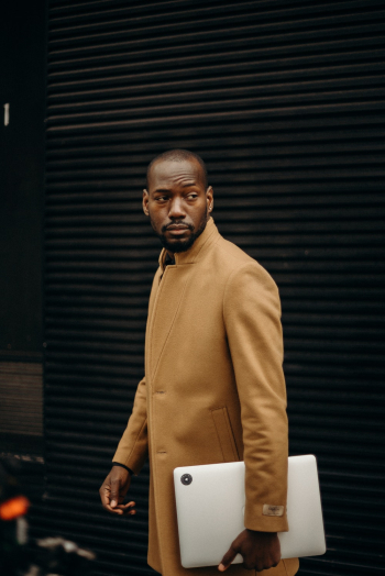 Man Holding Laptop Computer