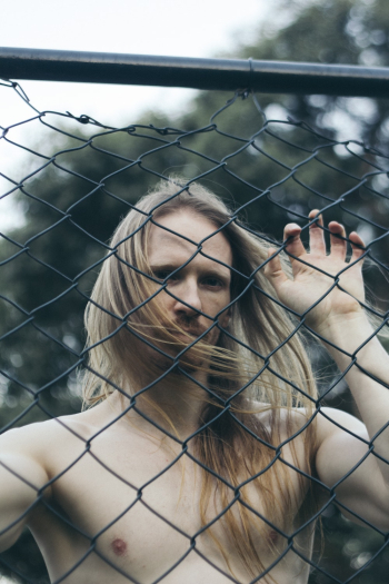 Man Holding Link Fence