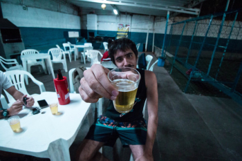Man Holding Liquor Filled Drinking Cup Man Holding Liquor Filled Drinking Cup