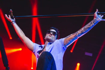 Man Holding Microphone Stand Man Holding Microphone Stand