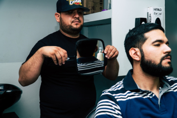 Man Holding Mirror Behind Man Man Holding Mirror Behind Man