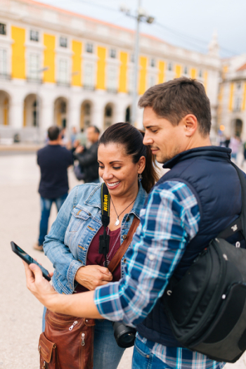 Man Holding Smartphone Beside Woman Man Holding Smartphone Beside Woman
