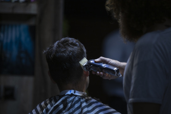 Man Holds Black Hair Shaver Man Holds Black Hair Shaver