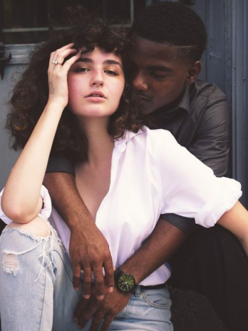man hugging woman while taking photo of each other man hugging woman while taking photo of each other