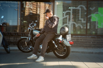 Man in Black Hooded Jacket Sitting on Motorcycle Man in Black Hooded Jacket Sitting on Motorcycle