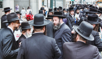Man in Black Suit Jackets and Black Hats Man in Black Suit Jackets and Black Hats