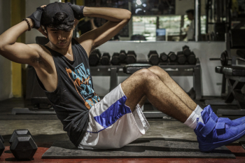Man In Black Tank Top Inside Gym Man In Black Tank Top Inside Gym