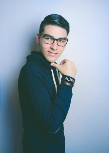 Man in Blue Hooded Jacket and Black Framed Eyeglasses Man in Blue Hooded Jacket and Black Framed Eyeglasses