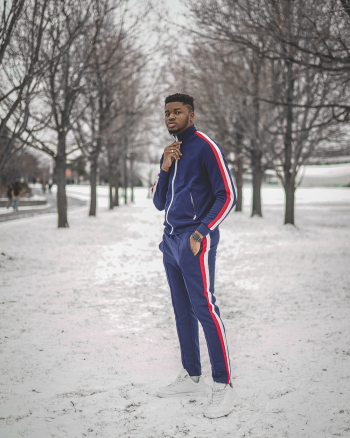 Man in Blue Track Suit Standing on Snow Man in Blue Track Suit Standing on Snow