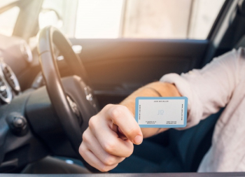 Man in car with business card mockup Free Psd