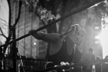 man in mask inside wrestling ring man in mask inside wrestling ring
