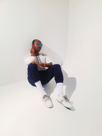 man in white sweater sitting man in white sweater sitting