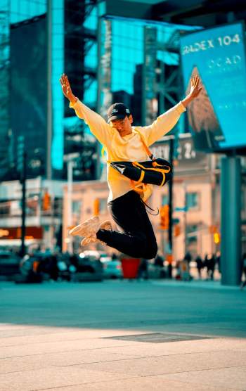 Man in Yellow Long-sleeved Shirt Jumping Man in Yellow Long-sleeved Shirt Jumping