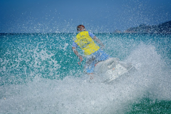Man in Yellow Shirt Using Personal Watercraft Man in Yellow Shirt Using Personal Watercraft