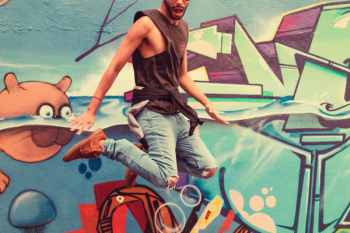 Man Jumping Beside Wall Paint Man Jumping Beside Wall Paint