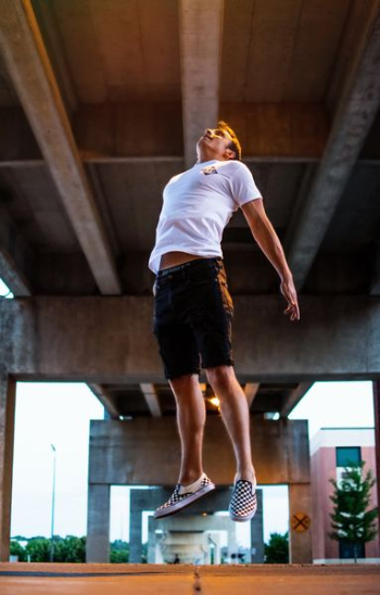 man jumping during daytime man jumping during daytime