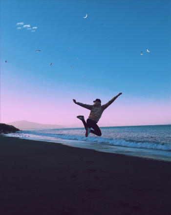 Man Jumping during Sunset on a Beach Man Jumping during Sunset on a Beach