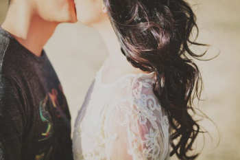 man kissing woman man kissing woman