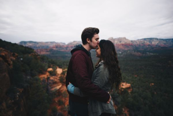 man kissing woman's forehead man kissing woman's forehead