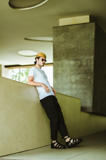 man leaning against wall man leaning against wall