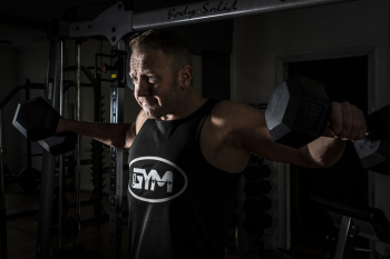 Man Lifting Dumbbells Man Lifting Dumbbells