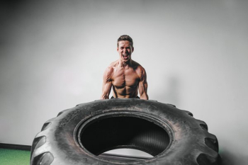 Man Lifts Tire Exercise Man Lifts Tire Exercise