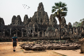 Man Looking At An Ancient Temple Man Looking At An Ancient Temple