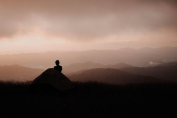 man looking at mountain man looking at mountain