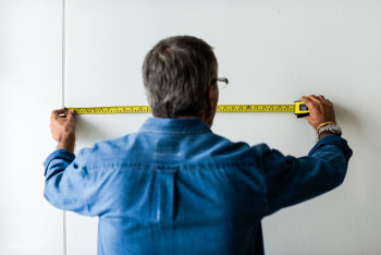 Man measuring the wall with a measuring tape | Free stock photo - 527938 Man measuring the wall with a measuring tape | Free stock photo - 527938