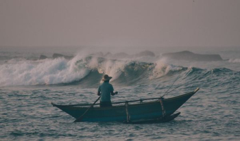 man on boat during daytime man on boat during daytime