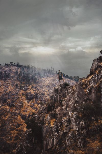 man on cliff mountain man on cliff mountain