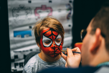 Man Painted Boy's Face Man Painted Boy's Face