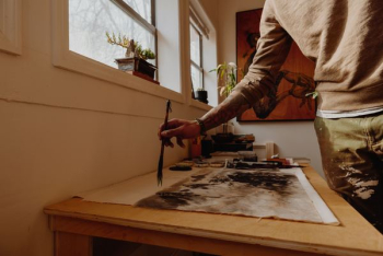 man painting on white canvas man painting on white canvas