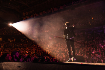 Man Performing on Stage Man Performing on Stage