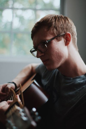 man playing acoustic guitar man playing acoustic guitar