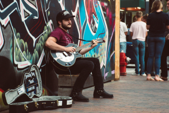 Man Playing Black Cutaway Guitar Man Playing Black Cutaway Guitar