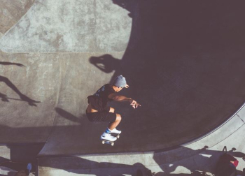 man playing skateboard on skateboard scope man playing skateboard on skateboard scope