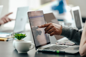 Man Pointing At Laptop Screen Analytics Man Pointing At Laptop Screen Analytics