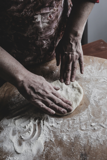 Man processing dough Man processing dough