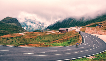 Man Riding Bike On Road Man Riding Bike On Road