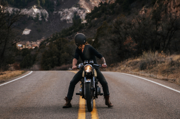 Man Riding Boxer Motorcycle on Road Man Riding Boxer Motorcycle on Road