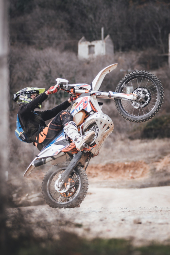 Man Riding Motocross Dirt Bike Man Riding Motocross Dirt Bike