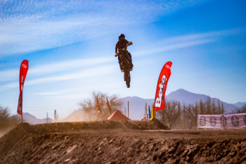 Man Riding Motocross Dirt Bike Doing Stunt