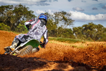 Man Riding Motocross Dirt Bike on Track Man Riding Motocross Dirt Bike on Track